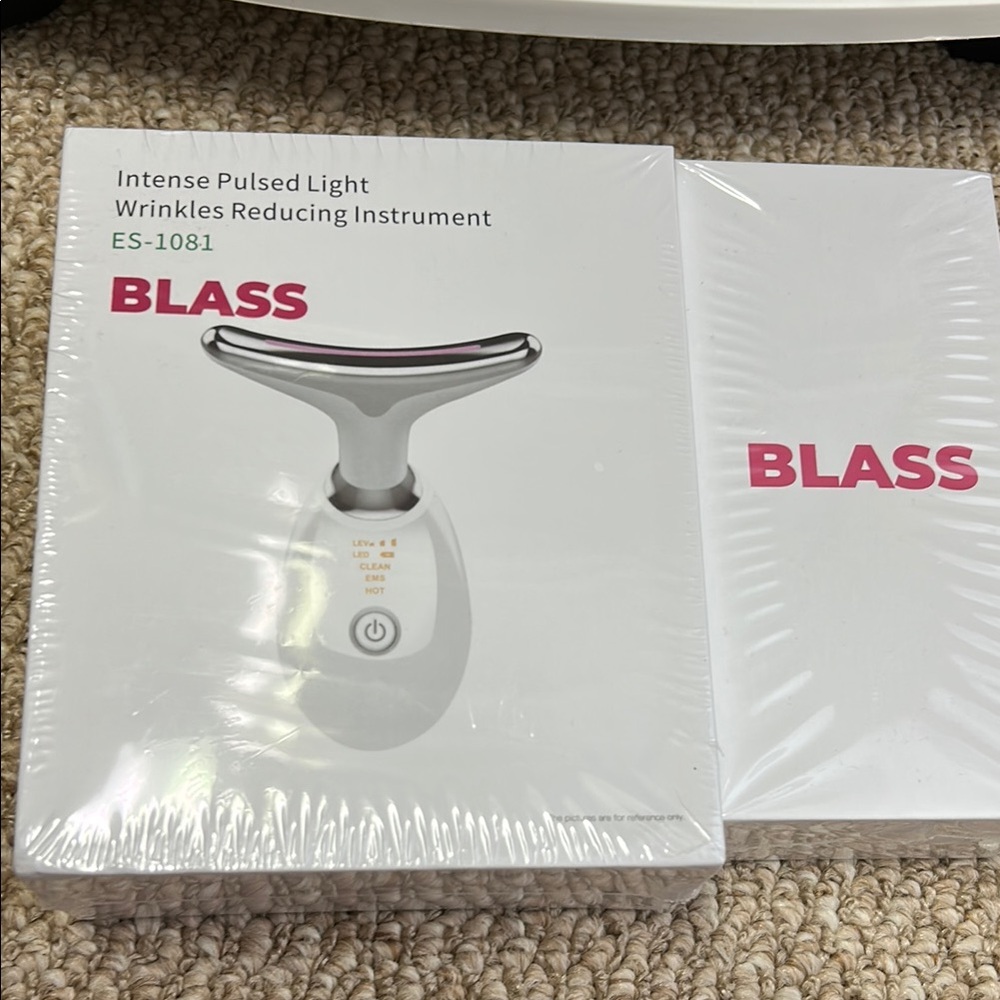 White and Silver Skincare Tool with Modern Design
